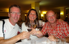 The group relaxes with a glass of wine after the hiking tour in Liguria